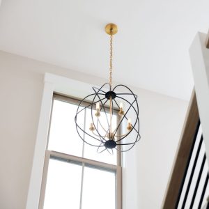 Image of a pendant light in a high ceiling stairwell